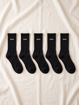NƟRM Everyday Crew black styled with a neutral shoe, everyday wear, mid-calf shot.
