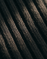 Close-up of the silver-ion knit on NƟRM Everyday Crew black, showing fibre woven into every yarn.