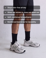 NƟRM Plain Crew in black worn with sneakers. Stays odor-free all day, silver-ion woven in, soft cushioned and breathable, reinforced heel and toe.