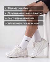 NƟRM Signature Crew in white worn with white sneakers. Stays odor-free all day, silver-ion woven in, soft cushioned and breathable, reinforced heel and toe.